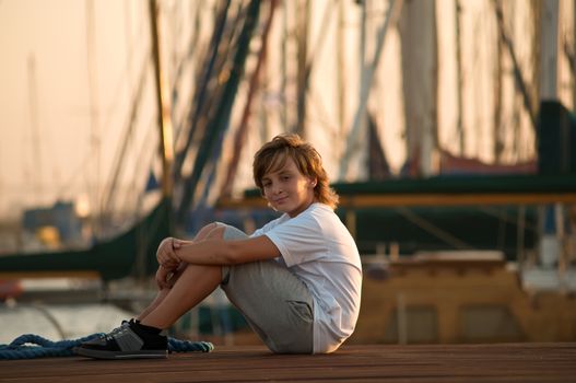 Portrait of a boy on the docks at the yacht club in Tel Aviv.