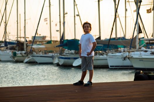 Portrait of a boy on the docks at the yacht club in Tel Aviv.