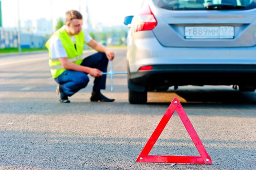 warning triangle and help the mechanic on the road