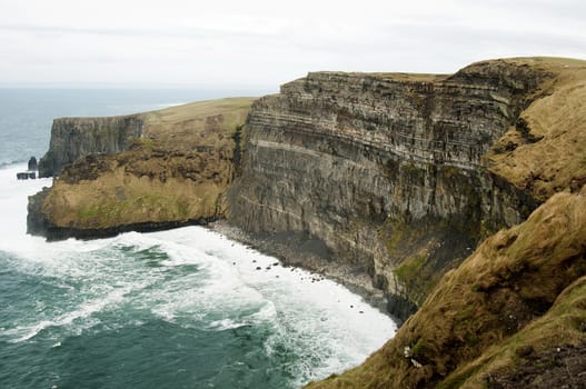 The Cliffs of Moher (Irish: Aillte an Mhothair) are located at the southwestern edge of the Burren region in County Clare, Ireland
