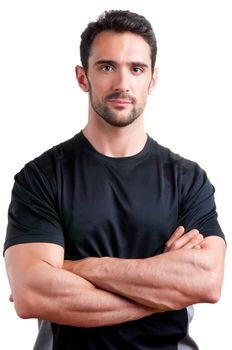 Personal trainer with is arms crossed, isolated in white