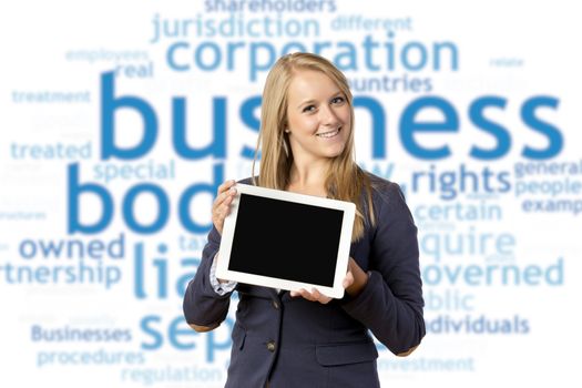 Young blond woman in business dress holding a tablet computer, isolated on white background
