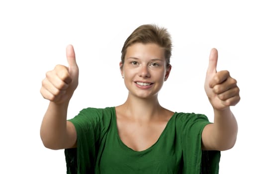 Pretty woman in green top with thumb up isolated on white background