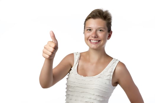 Young pretty girl in white top with thumb up, isolated on white background