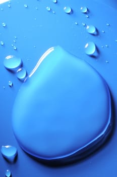 Some Water Drops on a Blue Textured Background