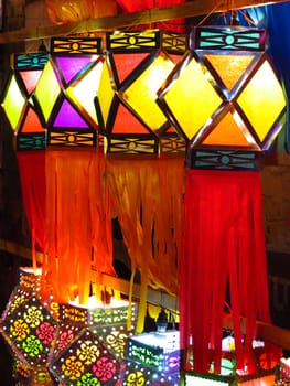A decorated line of traditional colorful Diwali lanterns lit beautifully on the occasion of Diwali festival in India