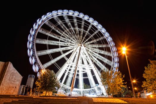 Working big wheel at night in Zaragoza, Spain