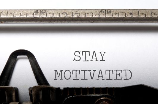 Stay motivated heading printed on a typewriter 