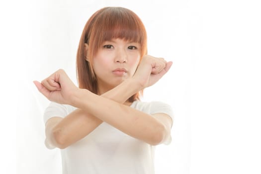 Young Asian woman making stop gesture over white background