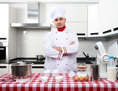 Male chef at kitchen getting ready to cook