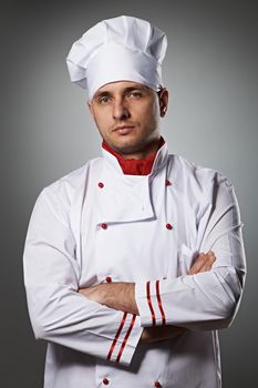 Male chef portrait against grey background