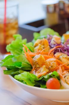 boiled  shrimp and vegetable salad with  sauce in white bowl