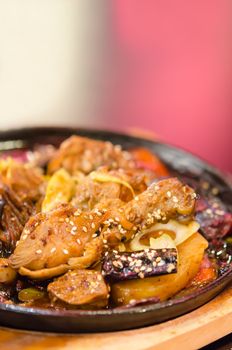 close up of baked chicken with vermicelli , potato , vegetable and soy sauce 