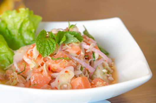 close up of spicy salmon salad with  mixed fresh vegetable 