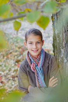 Portrait of beautiful girl walking in a autumn park
