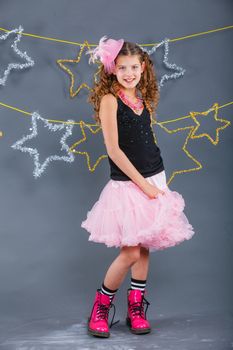 Fashion girl is wearing masquerade costume. Holiday theme/Emotion child.