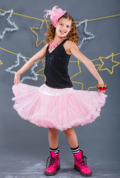 Fashion girl is wearing masquerade costume. Holiday theme/Emotion child.