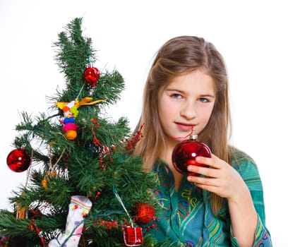 Christmas theme - Beautiful girl decorating christmas tree. Isolated on white backround.