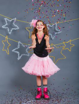 Fashion girl is wearing masquerade costume. Holiday theme/Emotion child.
