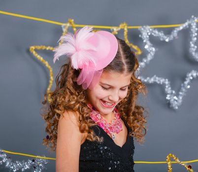 Fashion girl is wearing masquerade costume. Holiday theme/Emotion child.
