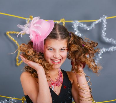Fashion girl is wearing masquerade costume. Holiday theme/Emotion child.