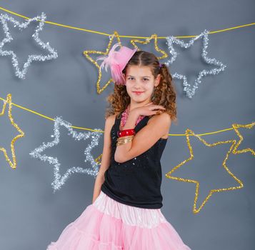 Fashion girl is wearing masquerade costume. Holiday theme/Emotion child.