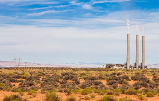 Electrical power station in the middle of a green field