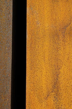 Orange Patterns on the Rusty Surface of the Metal