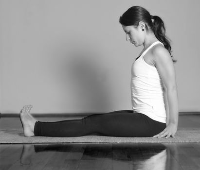 Girl doing Dandasana yoga pose