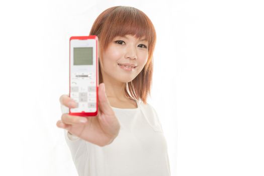 Asian female holding cordless phone