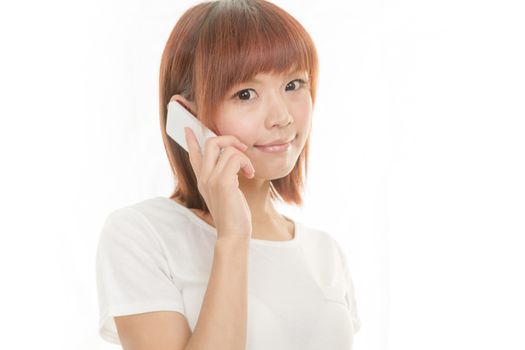 Asian female holding cordless phone