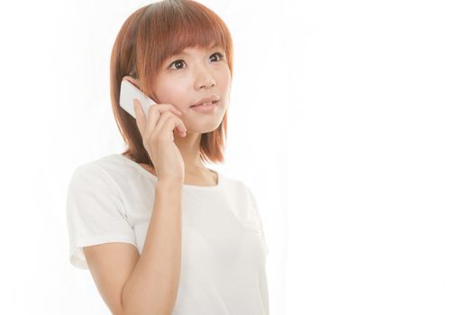 Asian female holding cordless phone