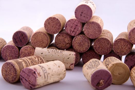 Bunch of corks with different designs in a white background