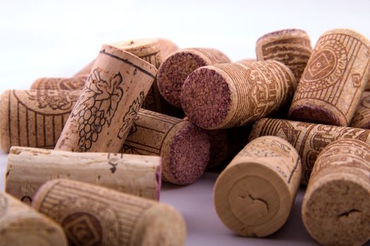 Bunch of corks with different designs in a white background