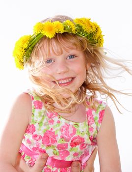 Portrait of cute little girl with dandelion wreath