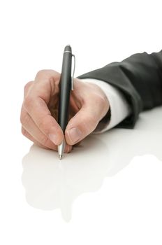 Detail of business man hand holding a pen. Isolated over white background with reflection.