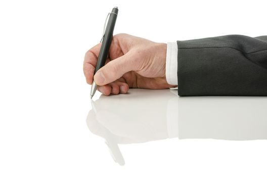 Male hand holding a pen. Isolated over white background with reflection.