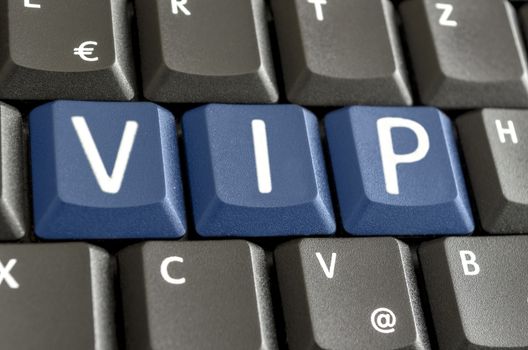 Abbreviation VIP written with blue keys on computer keyboard.