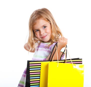 Shopping little girl happy smiling holding shopping bags isolated on white background.