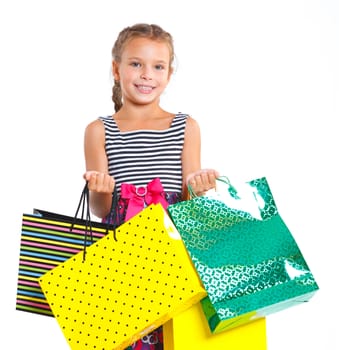 Shopping little girl happy smiling holding shopping bags isolated on white background.