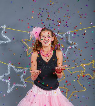 Fashion girl is wearing masquerade costume. Holiday theme/Emotion child.