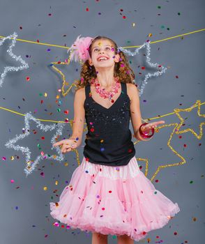 Fashion girl is wearing masquerade costume. Holiday theme/Emotion child.