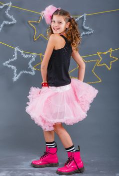 Fashion girl is wearing masquerade costume. Holiday theme/Emotion child.