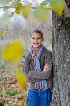 Portrait of beautiful girl walking in a autumn park