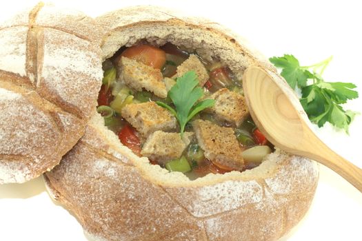 Bread Soup with parsley on a light background