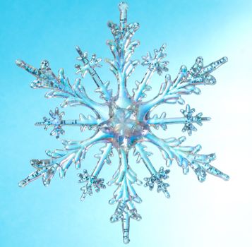 Snowflake shape, photo on the blue background