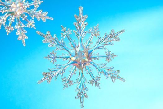 Snowflake shape, photo on the blue background