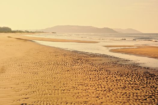 Wavy relief on the sandy beach in Goa, India