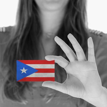 Woman showing a business card, black and white, Puerto Rico