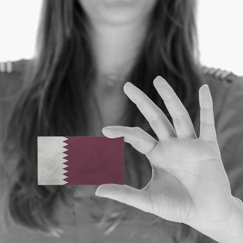 Woman in showing a business card, Qatar